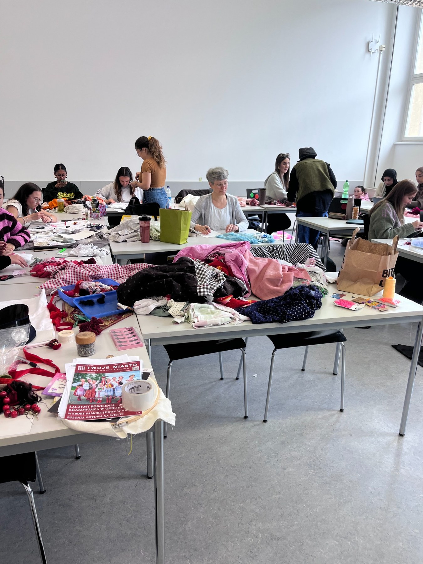 University workshop participants working together with textile materials